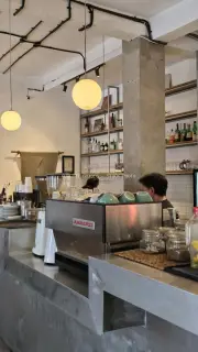 Modern Cafe Interior with Barista and Espresso Machine in Bali