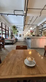 Morning Latte in Modern Industrial Cafe Interior in Bali