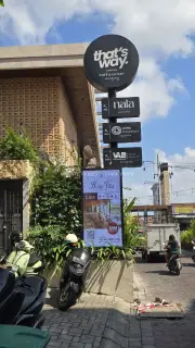 That's Way Canggu Cafe Signage and Vibrant Bali Street Scene