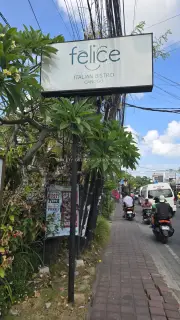 Felice Italian Bistro Canggu Sign on Busy Bali Street