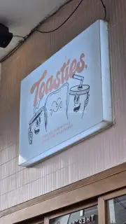 Toasties Cafe Sign in Bali: Toasted Sandwiches, Coffee, Milkshakes