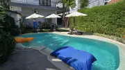 Bali Backpackers Hostel Pool Area with Tropical Lounge Seating