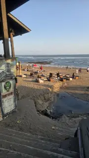 Golden Hour at Bali Beach Bar with People and Ocean View