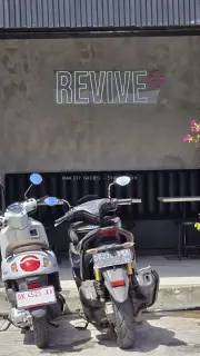 Modern "REVIVE +" Neon Sign with Scooters in Canggu, Bali
