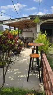 Tropical Outdoor Cafe Seating Area in Bali with Rustic Decor