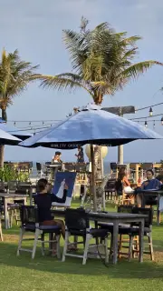 Artist Painting Outdoors at a Tropical Beachside Cafe in Bali