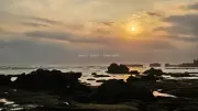 Dramatic Sunset over Mengening Beach, Bali with Silhouetted Rocks