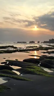 Golden Sunset over Mengening Beach, Bali with Mossy Rocks