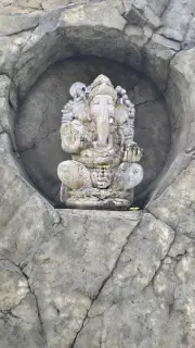 Ancient Stone Ganesha Statue in Bali Temple Niche