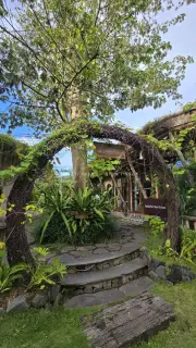 Rustic Balinese Garden Entrance with Lush Tropical Vines