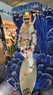 Surfer King Statue with Blue Wings at Bali Airport