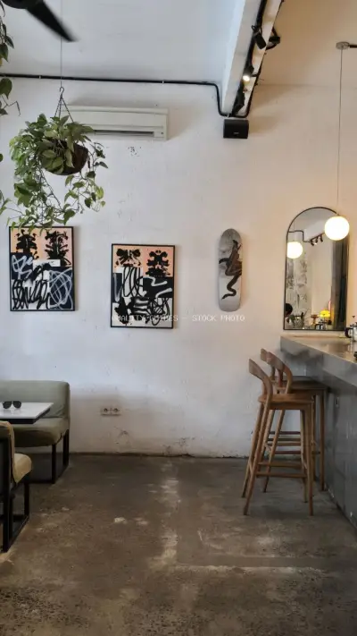 Modern Cafe Interior with Minimalist Design and Artistic Decor - stock photo
