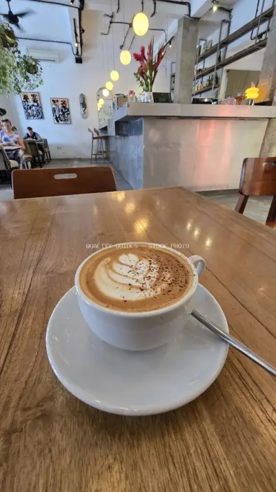 Delicious Latte Art Coffee in a Modern Bali Cafe Setting - stock photo