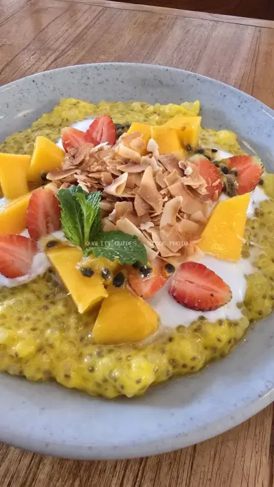 Vibrant Tropical Chia Pudding with Mango, Strawberry, Coconut Flakes - stock photo