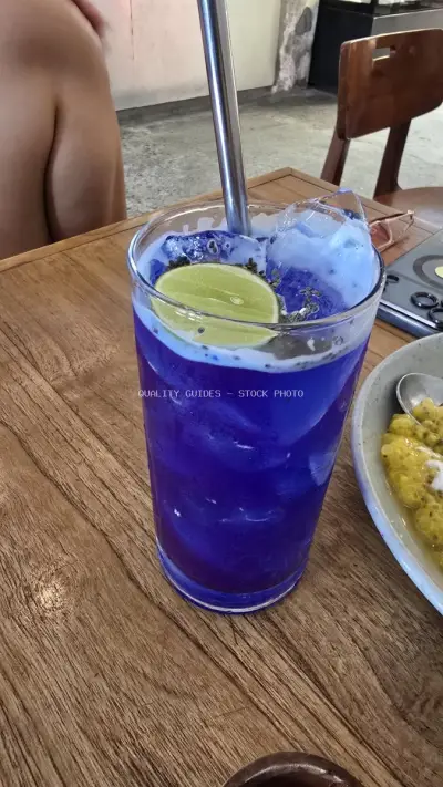 Vibrant Purple Butterfly Pea Drink with Lime in Bali Cafe - stock photo