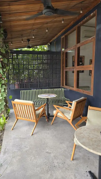 Relaxing Outdoor Cafe Seating Area in Bali with Tropical Vibes - stock photo