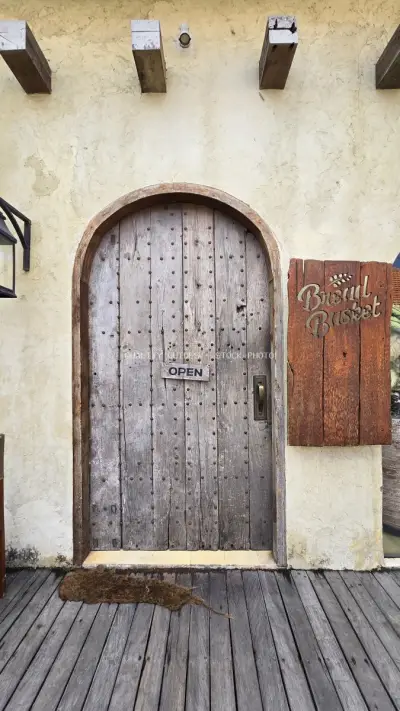 Rustic Wooden Door Entrance to Bread Basket Bakery in Bali - stock photo