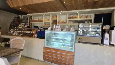 Bali Bakery Interior with Rustic Wood and Fresh Baked Goods - stock photo