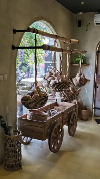 Rustic Bakery Interior with Fresh Bread Baskets and Natural Light - stock photo