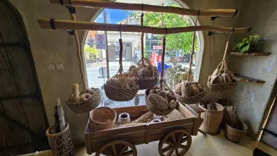 Rustic Artisan Bread Display at a Traditional Balinese Bakery - stock photo