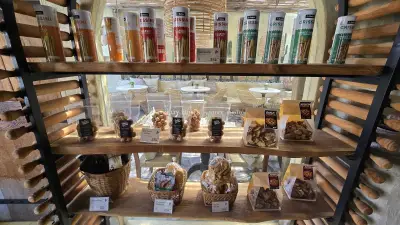 Artisanal Bakery Display with Grissini and Snacks in Bali Cafe - stock photo