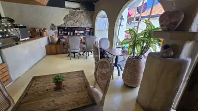 Inviting Rustic Cafe Interior in Bali with Earthy Decor - stock photo