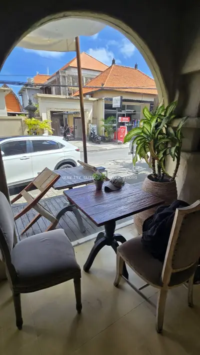 Cozy Cafe View of Bali Street Life and Traditional Architecture - stock photo