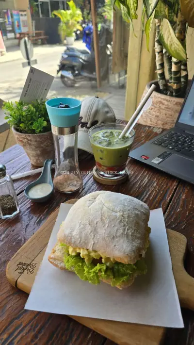 Delicious Egg Salad Sandwich and Matcha Latte at Bali Cafe - stock photo