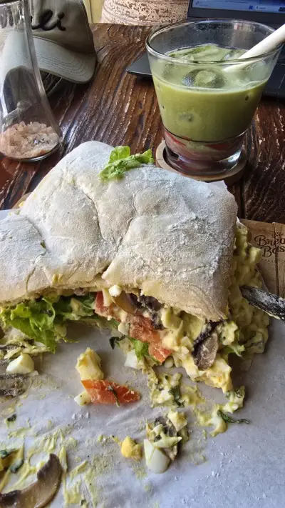 Delicious Ciabatta Sandwich and Iced Matcha Latte at Bali Cafe - stock photo