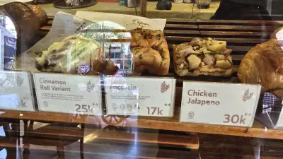 Freshly Baked Goods Displayed in a Bali Bakery Window - stock photo