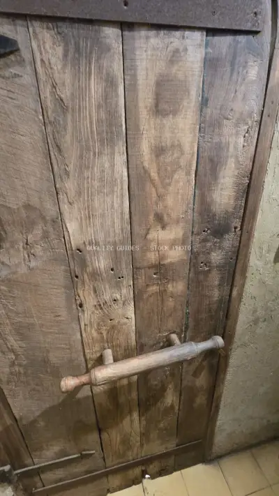 Rustic Wooden Door with Unique Rolling Pin Handle - stock photo