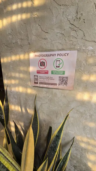 Photography Policy Sign at Bali Bakery with Snake Plants - stock photo