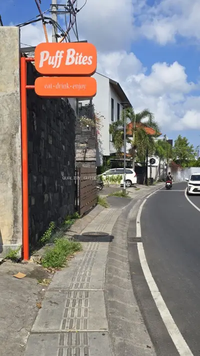 Puff Bites Cafe Signage on a Sunny Bali Street - stock photo