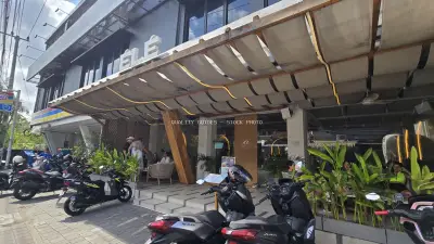 Modern Ele Restaurant Exterior in Bali with Parked Motorbikes - stock photo