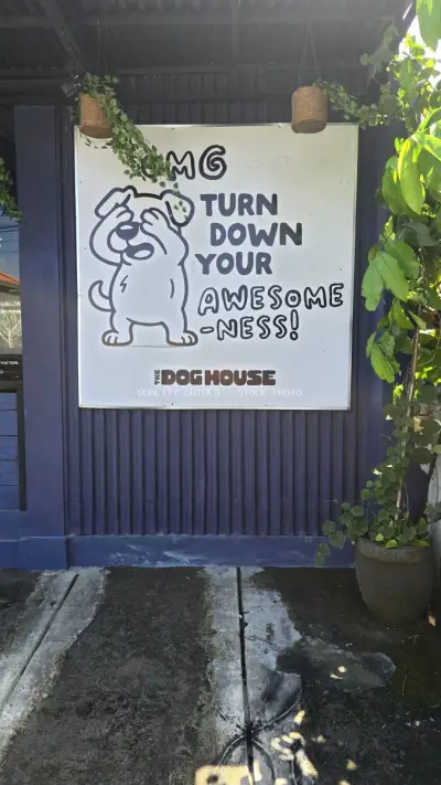 Humorous Dog House Cafe Sign in Bali, Indonesia - stock photo
