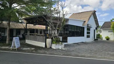 Poul Coffee Pastry Cafe in Bali with Traditional Thatched Roof - stock photo