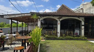 Tropical Outdoor Cafe in Bali with Traditional Architecture - stock photo