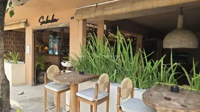 Inviting Outdoor Seating Area at Sababa Cafe in Sunny Bali - stock photo