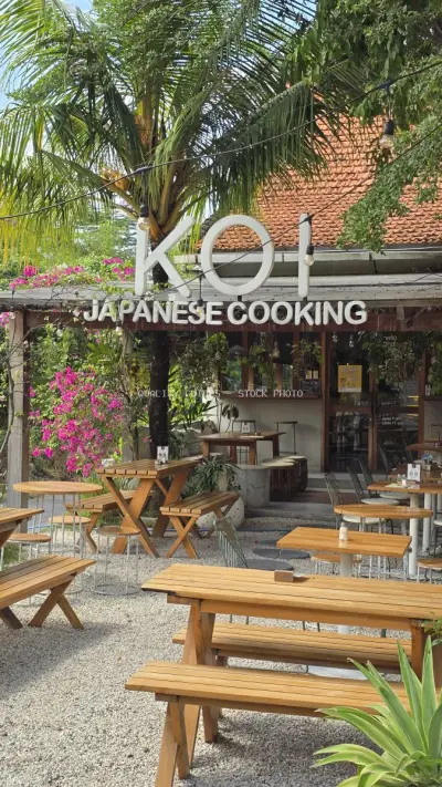 Inviting Outdoor Seating at Tropical Japanese Restaurant in Bali - stock photo
