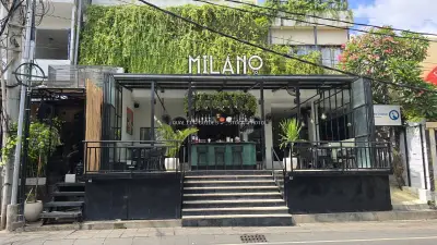 Modern Milano Italian Restaurant Exterior in Bali with Lush Greenery - stock photo