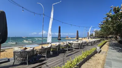 Beachfront Dining at Pier Eight Bali with Traditional Boats - stock photo