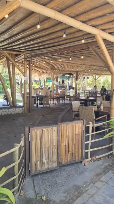 Tropical Bamboo Cafe Architecture with Outdoor Dining Ambiance in Bali - stock photo