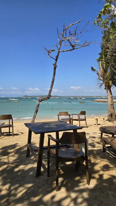 Empty Beach Cafe Tables Overlooking Mertasari Beach, Bali - stock photo