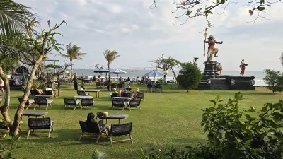 Bali Beach Club Relaxation: Tropical Oceanfront Dining at Seseh Beach - stock photo