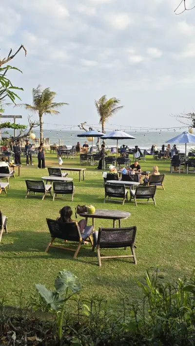 Tropical Beachfront Restaurant in Bali with Ocean Views - stock photo