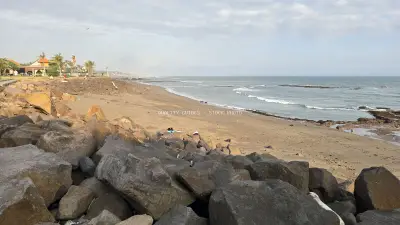 Seseh Beach Bali Coastline with Rocks, Sand, and Ocean - stock photo