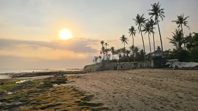 Golden Sunset Over Cemagi Beach, Bali with Palm Trees - stock photo
