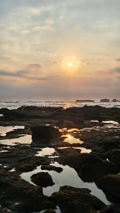 Golden Sunset over Rocky Cemagi Beach, Bali Tide Pools - stock photo