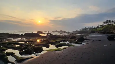 Golden Sunset over Rocky Cemagi Beach, Bali Tidal Pools - stock photo