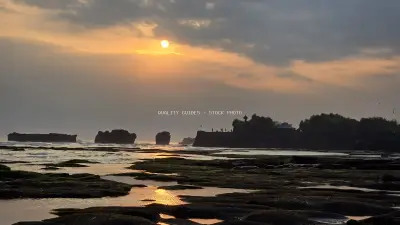 Golden Sunset over Tanah Lot Temple, Bali Coastline - stock photo